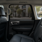 Breathable mesh shade fitted to a rear door window in a premium SUV cabin