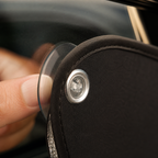 Clear suction-cup mounting detail on a bound blackout panel