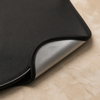 Black cabin-facing fabric and silver reflective reverse layer detail