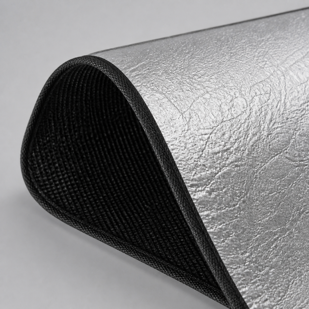Silver exterior and black cabin-facing blackout material detail