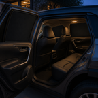 Parked unbranded SUV cabin with opaque fitted blackout shades at blue hour