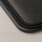 Macro detail of breathable black mesh and slim alloy magnetic edging