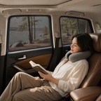 Passenger relaxing beside fitted breathable mesh window shades
