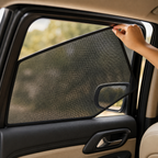 Close-up of a magnetic mesh shade edge being fitted into a side-window frame