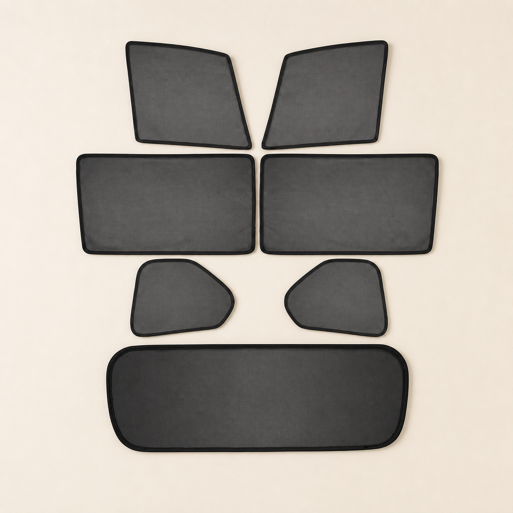 Seven custom-shaped black mesh panels arranged as a complete set