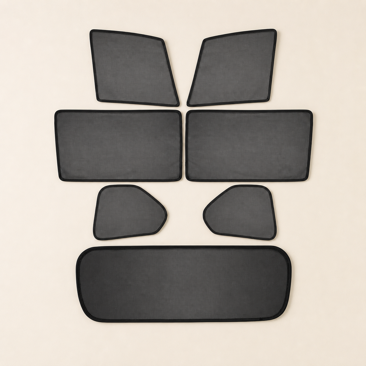 Seven custom-shaped black mesh panels arranged as a complete set